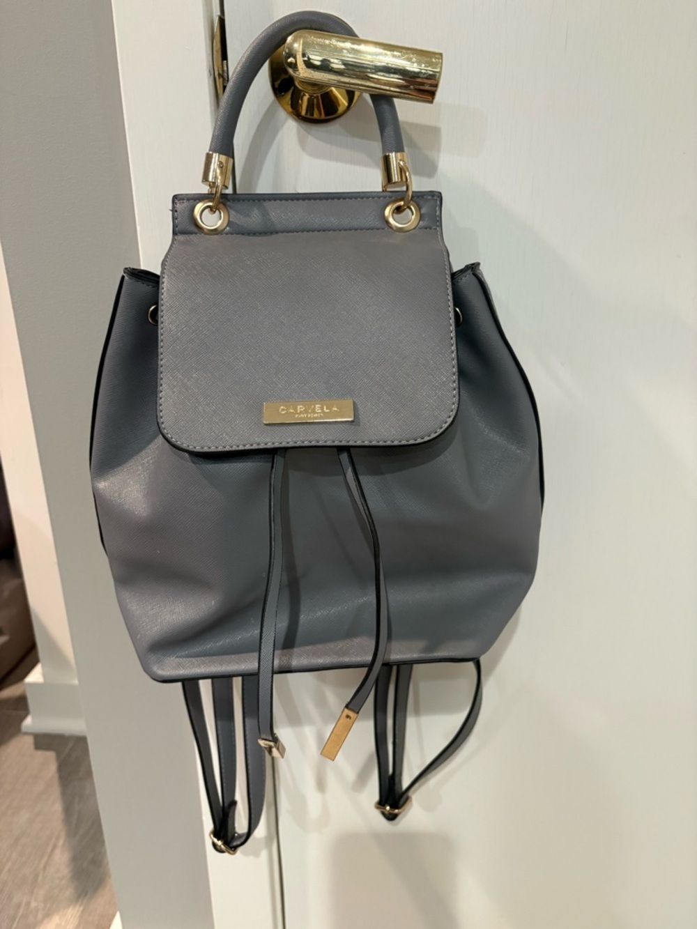 Gray Leather Drawstring Backpack with Gold Accents